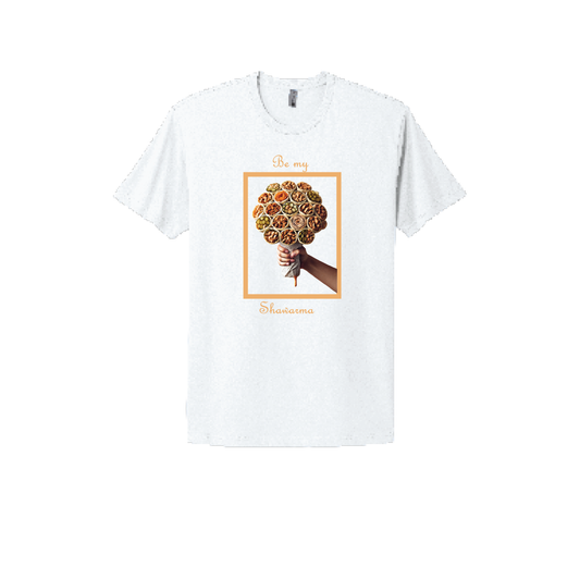 White T-shirt with a creative design featuring a bouquet of shawarma wraps held by a hand. The text reads 'Be my Shawarma' in an elegant font with warm orange tones, framed for a clean and modern look.