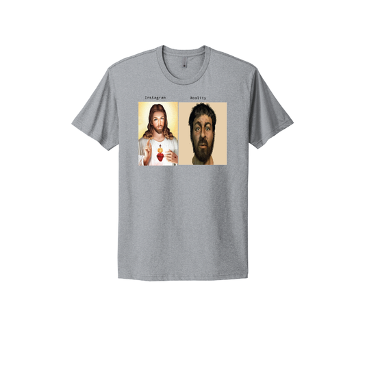 Grey T-shirt featuring a humorous comparison of 'Instagram vs Reality' with artistic depictions of Jesus, poking fun at modern perceptions and reality.